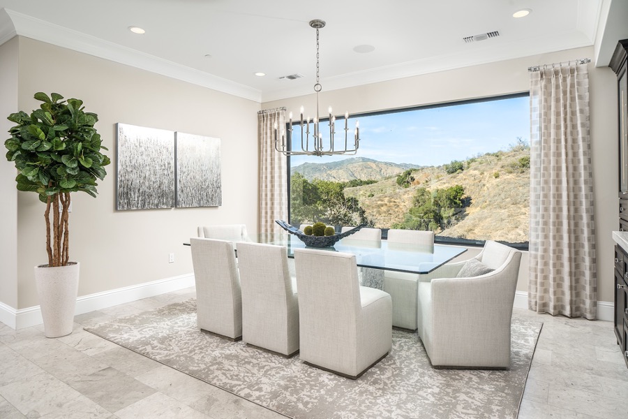 To make a smaller space look larger, consider a glass top table. Glass creates the illusion of space and gives a room a light, airy feel.