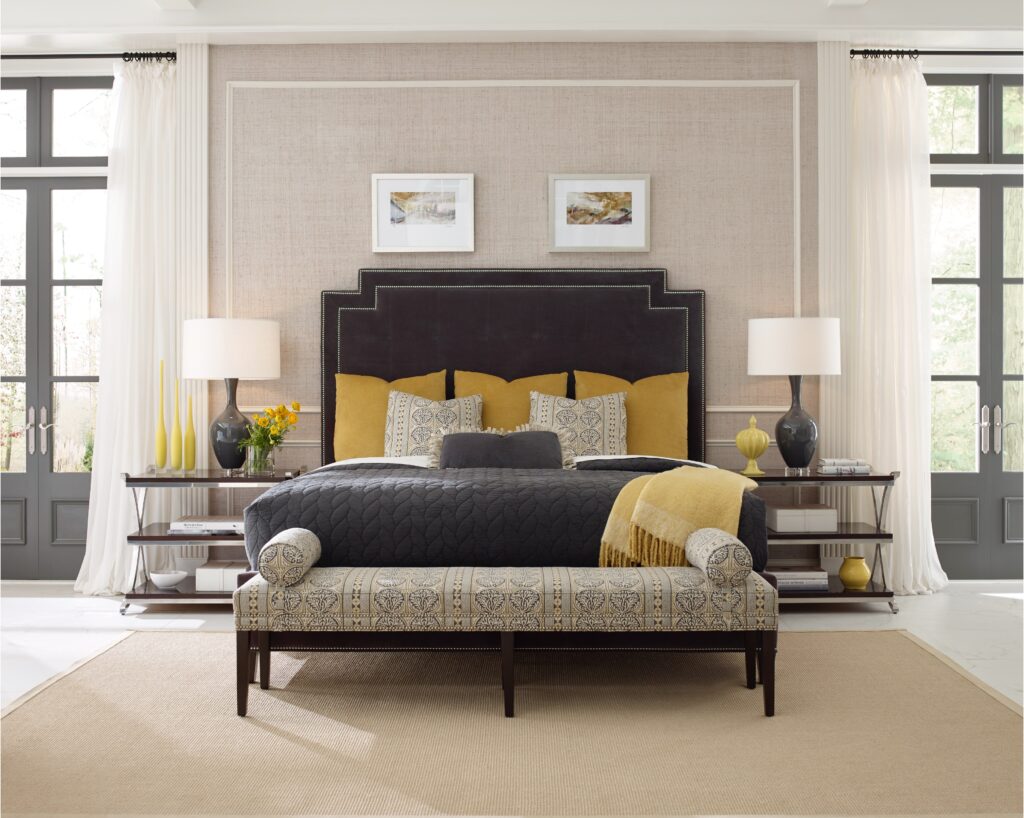 For a bedroom like this with a bed and a bench with touches of yellow, work with interior designer, Elif Eylül. 